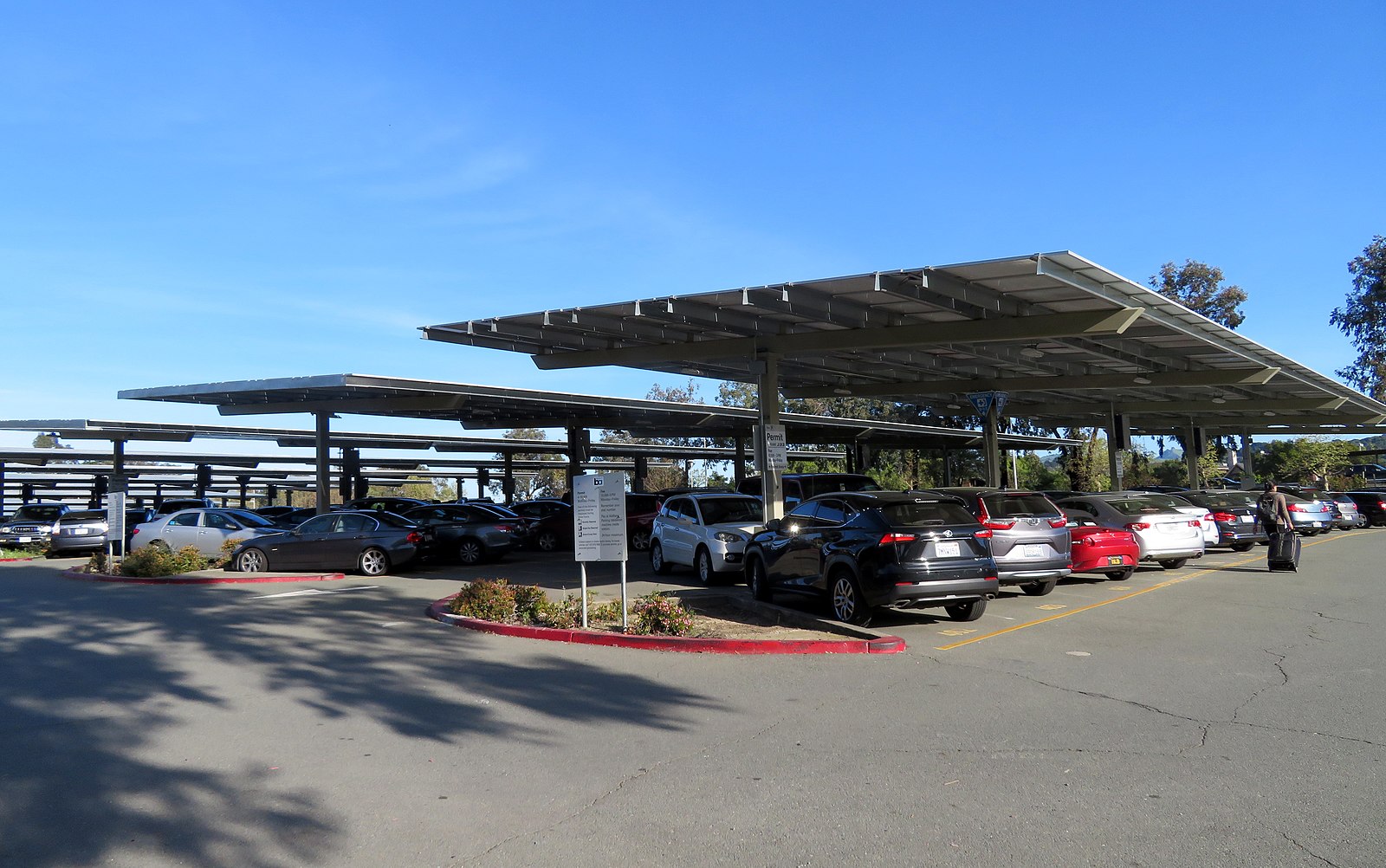image of parking lot with solar panels above it